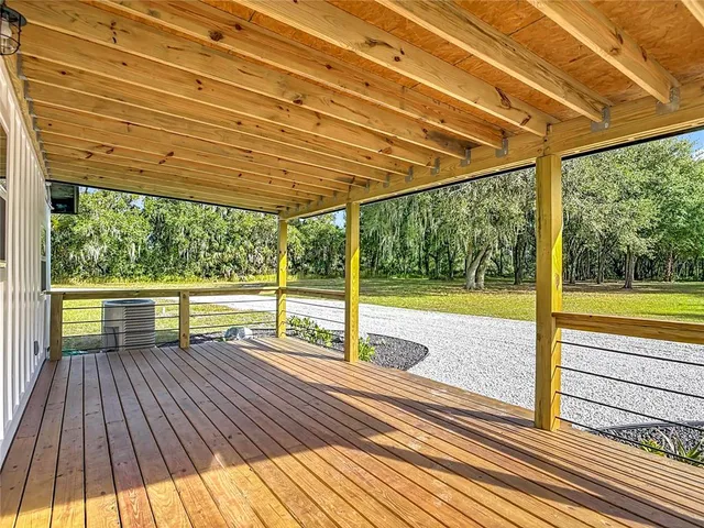 a kitchen with kitchen island granite countertop a sink stainless steel appliances and white cabinets