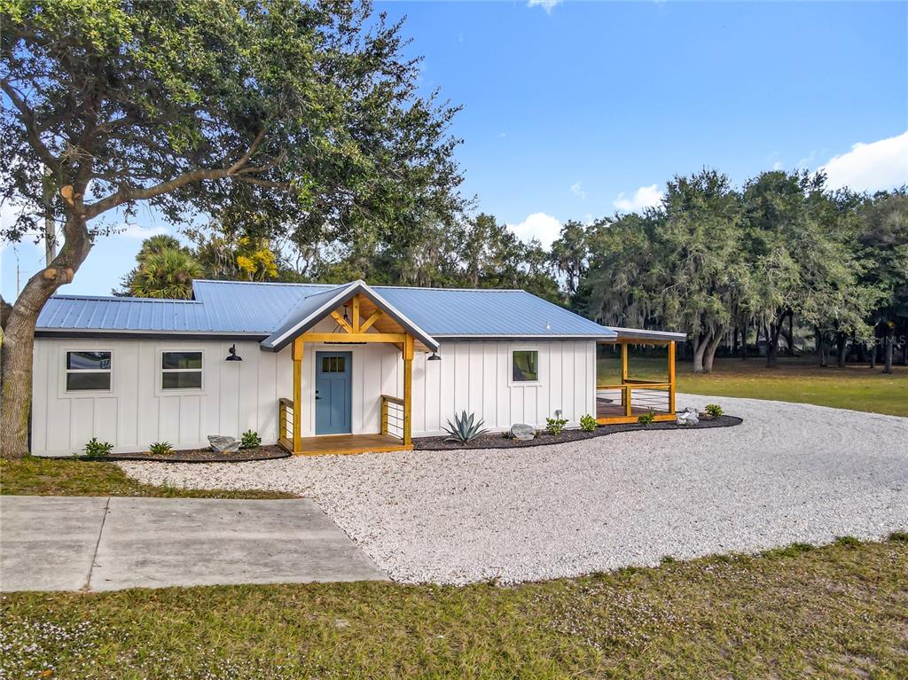 379 State Rte 415 Osteen, FL 32764 - Photo 2 of 48 a house with trees in the background