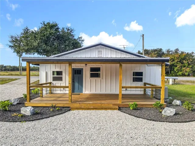 a front view of a house with a porch
