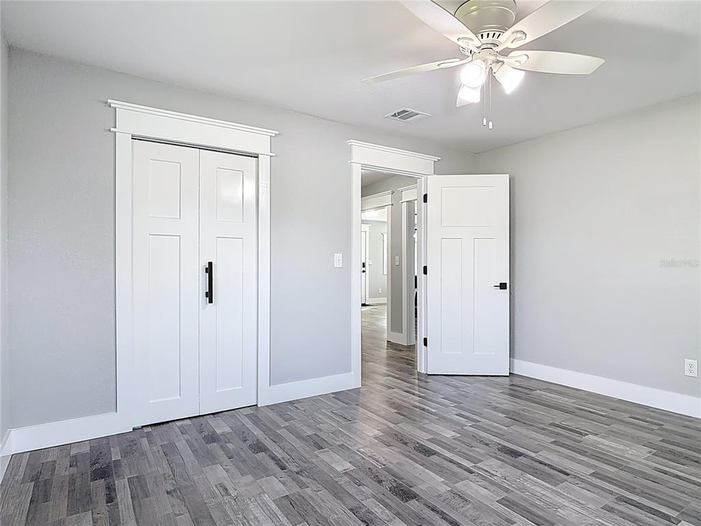 379 State Rte 415 Osteen, FL 32764 - Photo 35 of 48 a view of an empty room with wooden floor