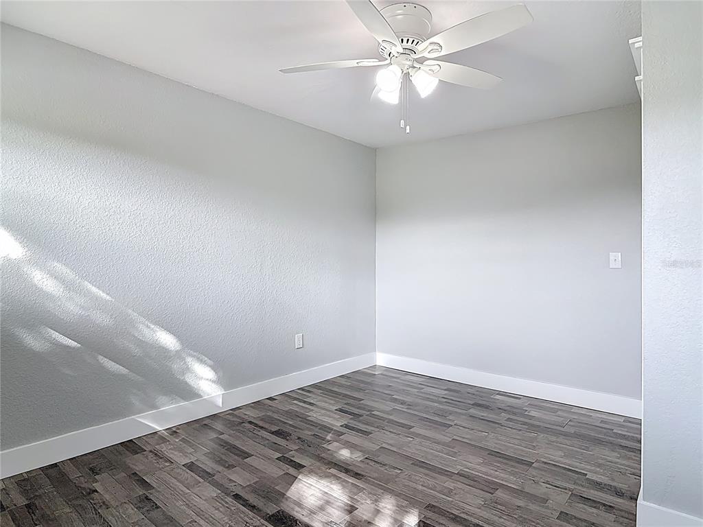 379 State Rte 415 Osteen, FL 32764 - Photo 37 of 48 wooden floor in an empty room