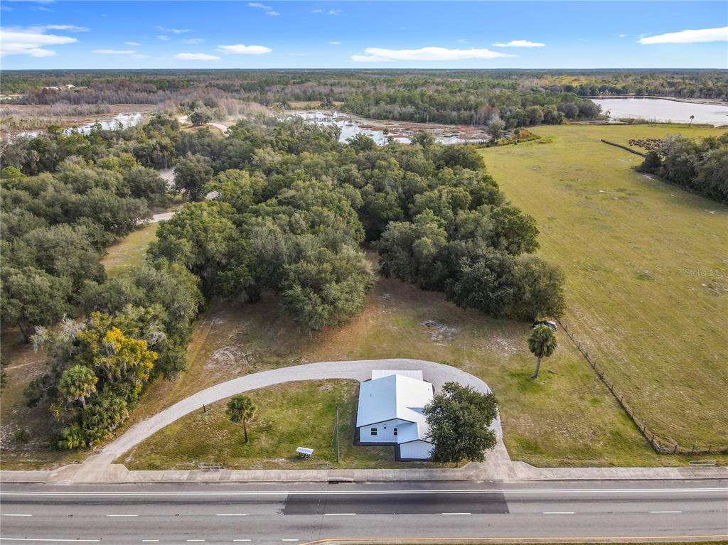 379 State Rte 415 Osteen, FL 32764 - Photo 4 of 48 a view of a lake from a yard