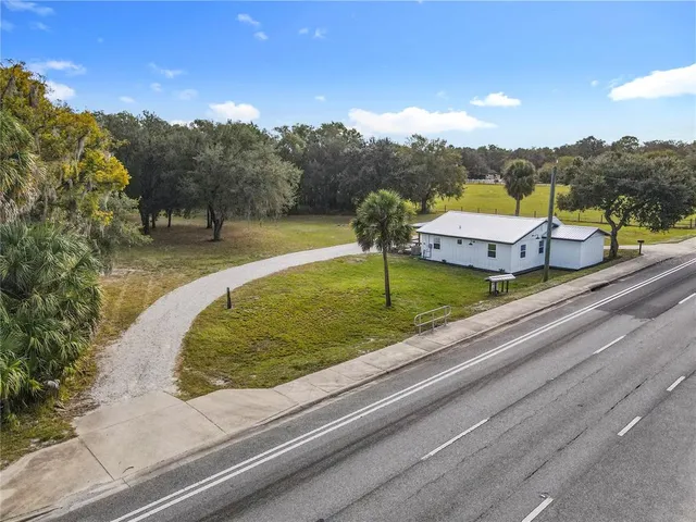 a view of outdoor space with deck and trees
