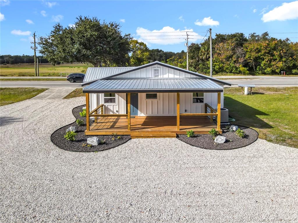 379 State Rte 415 Osteen, FL 32764 - Photo 10 of 48 a front view of a house with a yard