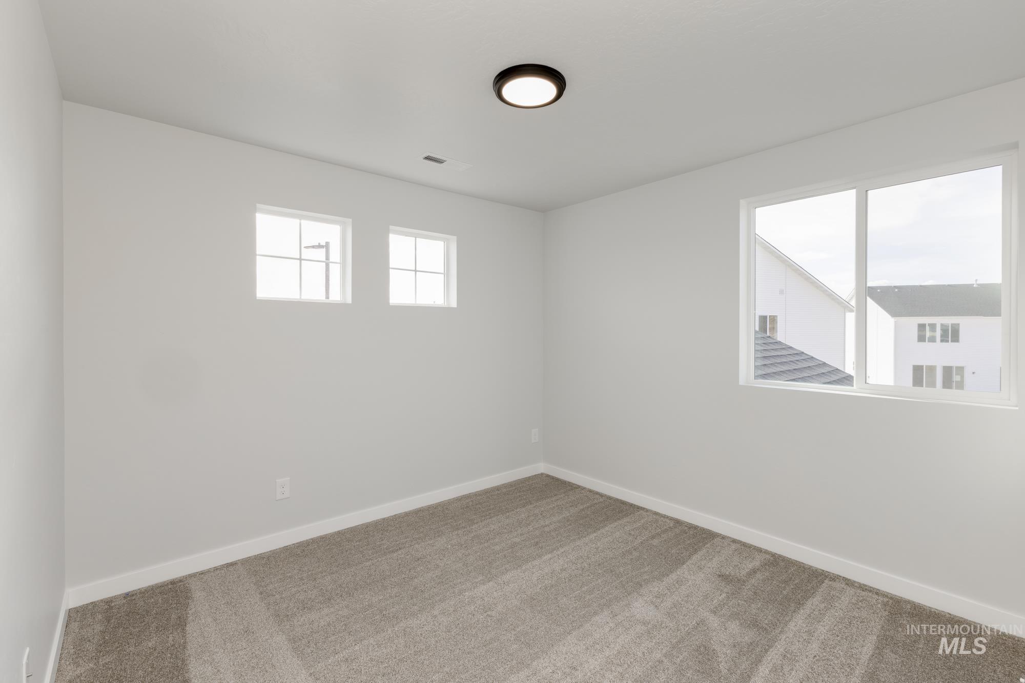 1702 Webb Brk Street Middleton, ID 83644 - Photo 14 of 21 Empty room with baseboards and carpet
