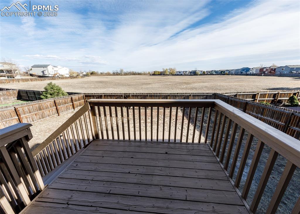 7715 Old Spec Road Peyton, CO 80831 - Photo 14 of 50 a balcony with wooden floor and city view
