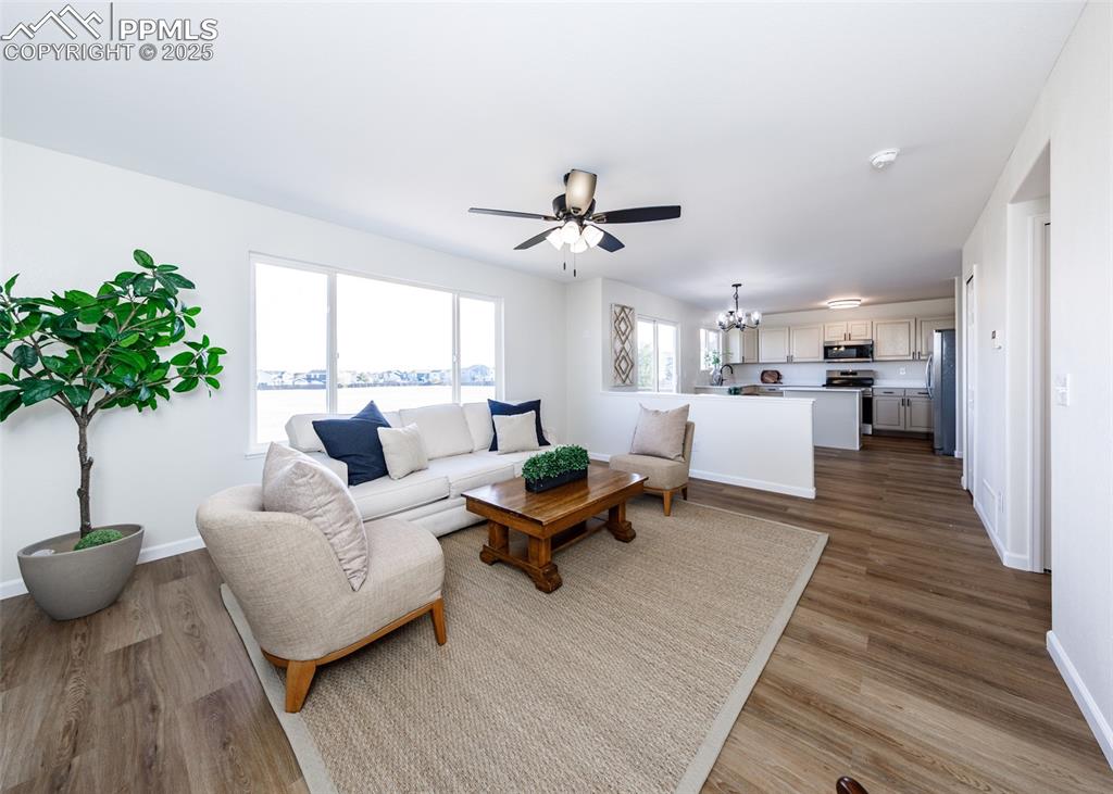 7715 Old Spec Road Peyton, CO 80831 - Photo 21 of 50 a living room with furniture and a potted plant