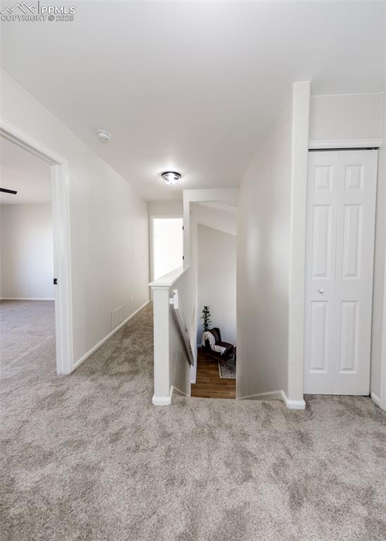 7715 Old Spec Road Peyton, CO 80831 - Photo 26 of 50 an empty room with a chair and mirror