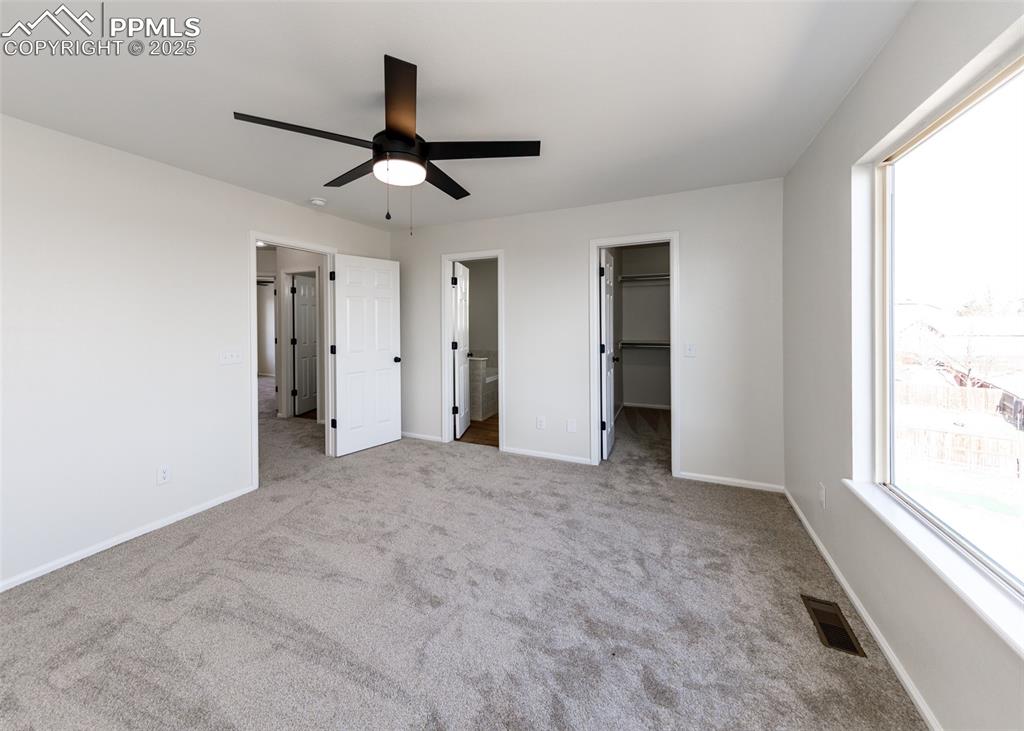 7715 Old Spec Road Peyton, CO 80831 - Photo 27 of 50 en view interior of a house with a ceiling fan and window
