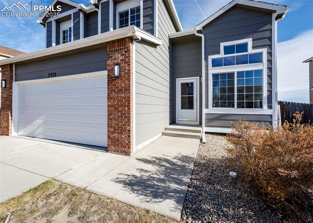 7715 Old Spec Road Peyton, CO 80831 - Photo 3 of 50 a front view of a house with a yard