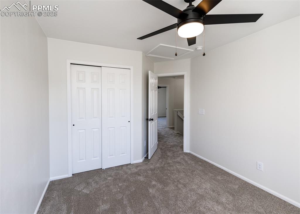7715 Old Spec Road Peyton, CO 80831 - Photo 32 of 50 a view of a room with a ceiling fan