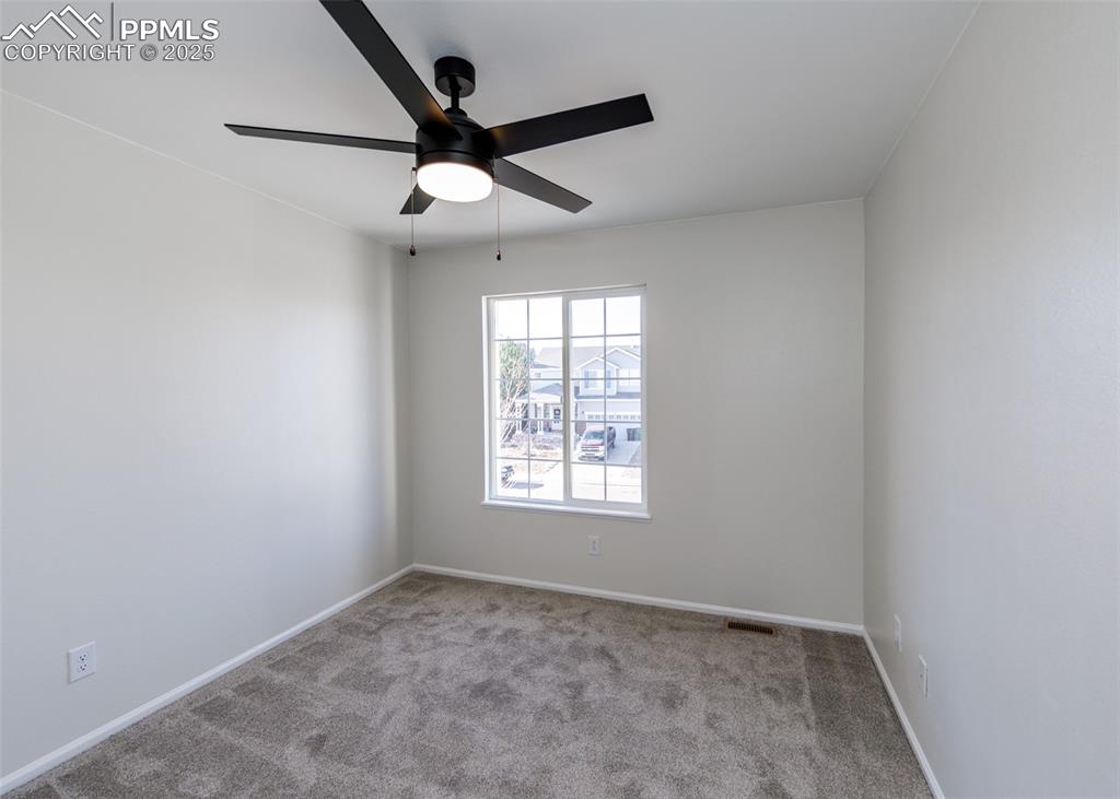 7715 Old Spec Road Peyton, CO 80831 - Photo 33 of 50 an empty room with a window and a fan