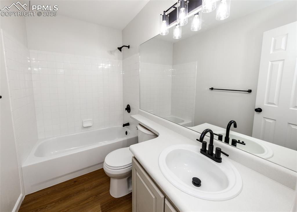 7715 Old Spec Road Peyton, CO 80831 - Photo 37 of 50 a bathroom with a sink a toilet and shower