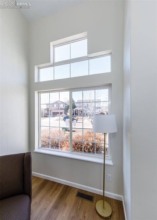 7715 Old Spec Road Peyton, CO 80831 - Photo 7 of 50 a room with wooden floor and a window