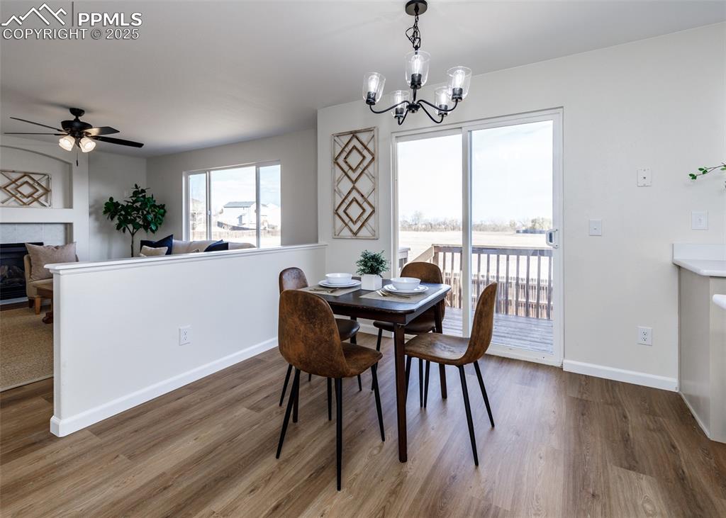 7715 Old Spec Road Peyton, CO 80831 - Photo 10 of 50 a view of a dining room with furniture window and wooden floor