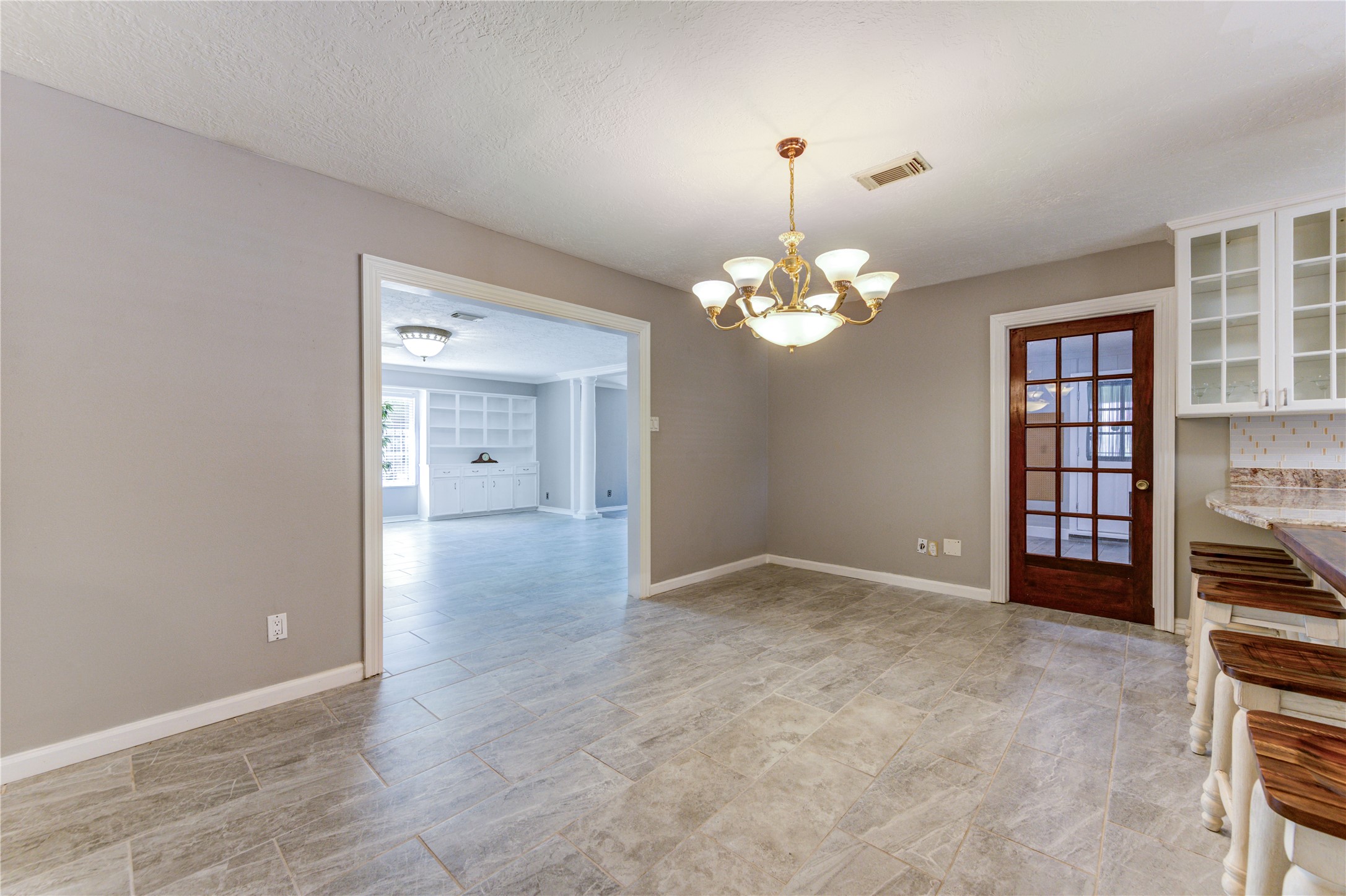 4018 Blalock Road Houston, TX 77080 - Photo 17 of 35 Bright dining area conveniently located next to the kitchen, offering the perfect setting for family meals and entertaining guests while maintaining an open, inviting flow.