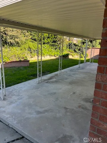 a view of a room with porch and wooden fence