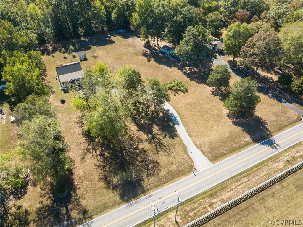 16381 Genito Road Moseley, VA 23120 - Photo 1 of 39 a view of backyard with swimming pool and outdoor seating