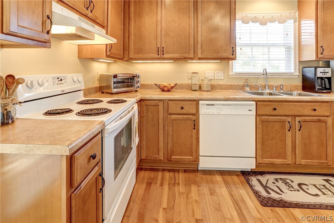 16381 Genito Road Moseley, VA 23120 - Photo 13 of 39 a kitchen with a sink stove and cabinets