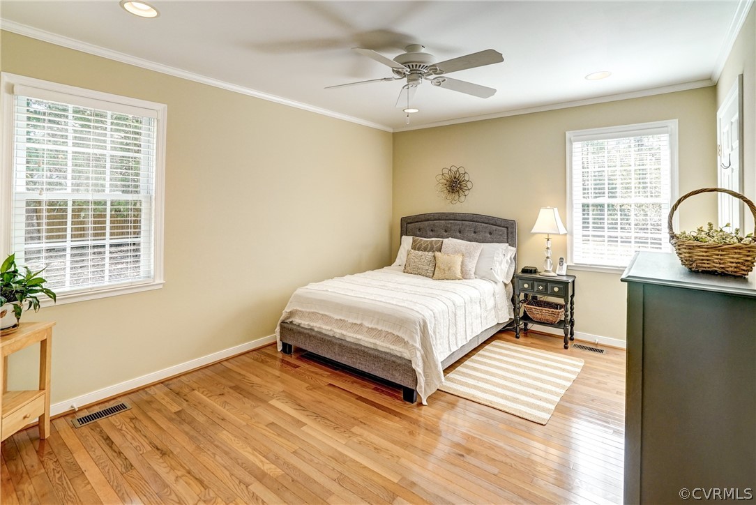 16381 Genito Road Moseley, VA 23120 - Photo 15 of 39 a bedroom with a bed and wooden floor