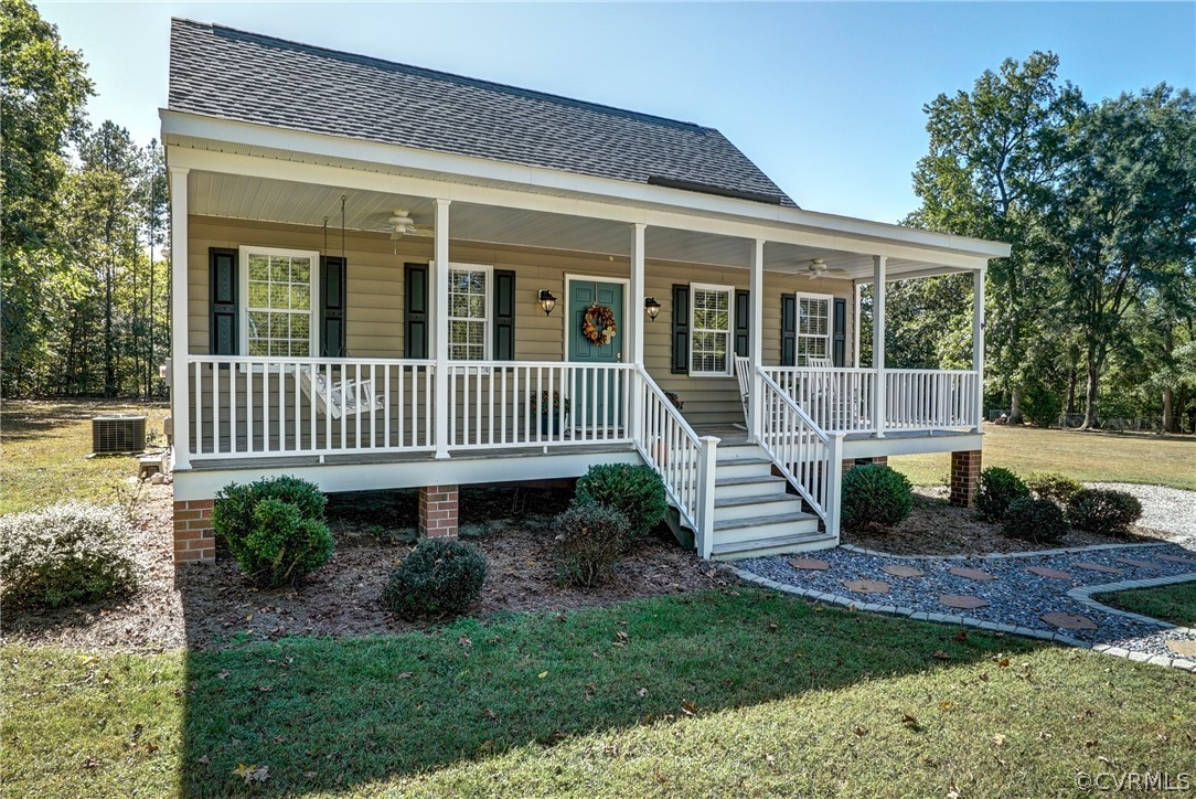 16381 Genito Road Moseley, VA 23120 - Photo 2 of 39 a front view of a house with a yard garden and glass windows