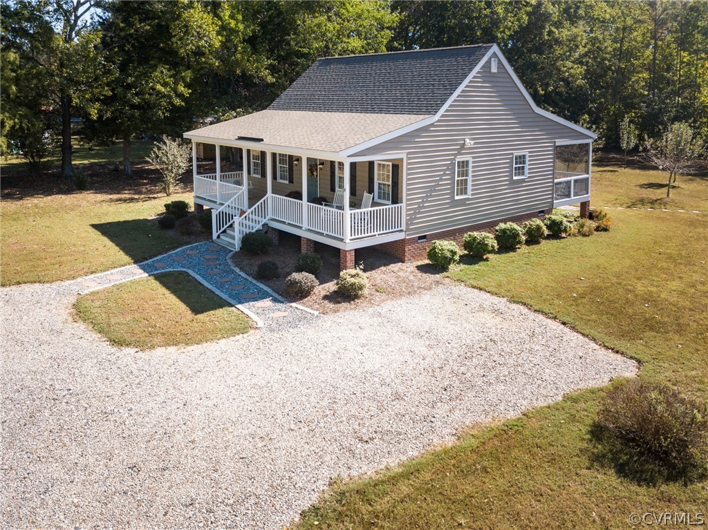16381 Genito Road Moseley, VA 23120 - Photo 28 of 39 a view of a house with a yard covered in the forest
