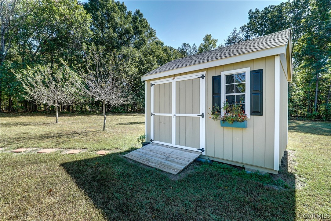 16381 Genito Road Moseley, VA 23120 - Photo 36 of 39 a view of backyard with small cabin