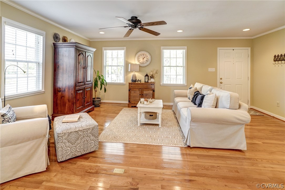 16381 Genito Road Moseley, VA 23120 - Photo 8 of 39 a living room with furniture chandelier and a large window