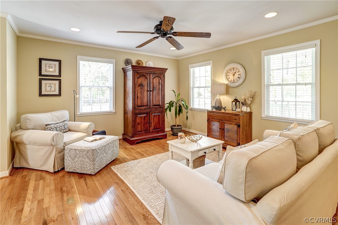 16381 Genito Road Moseley, VA 23120 - Photo 9 of 39 a living room with furniture a large window and a chandelier