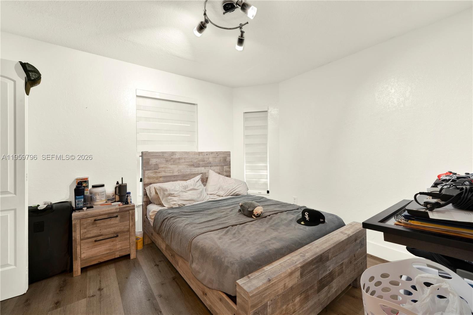 14600 Southwest 124th Place Miami, FL 33186 - Photo 10 of 34 a bedroom with a bed and wooden floor