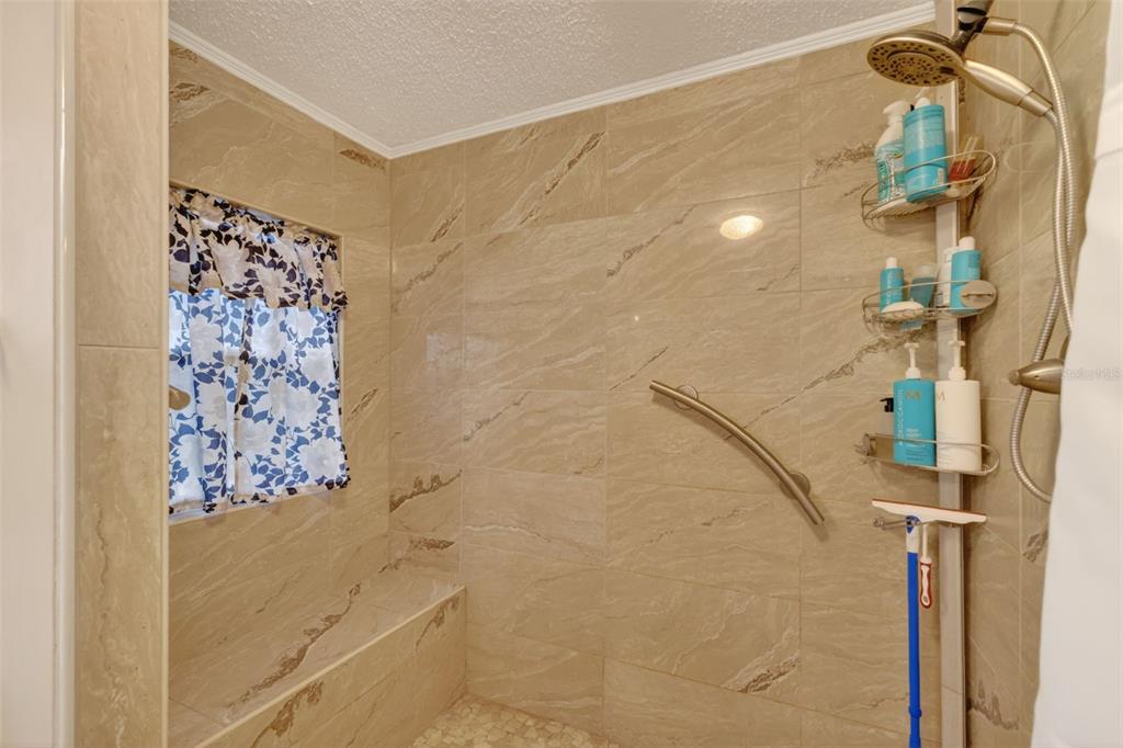 705 Devon Drive Lady Lake, FL 32159 - Photo 17 of 31 a bathroom with a shower