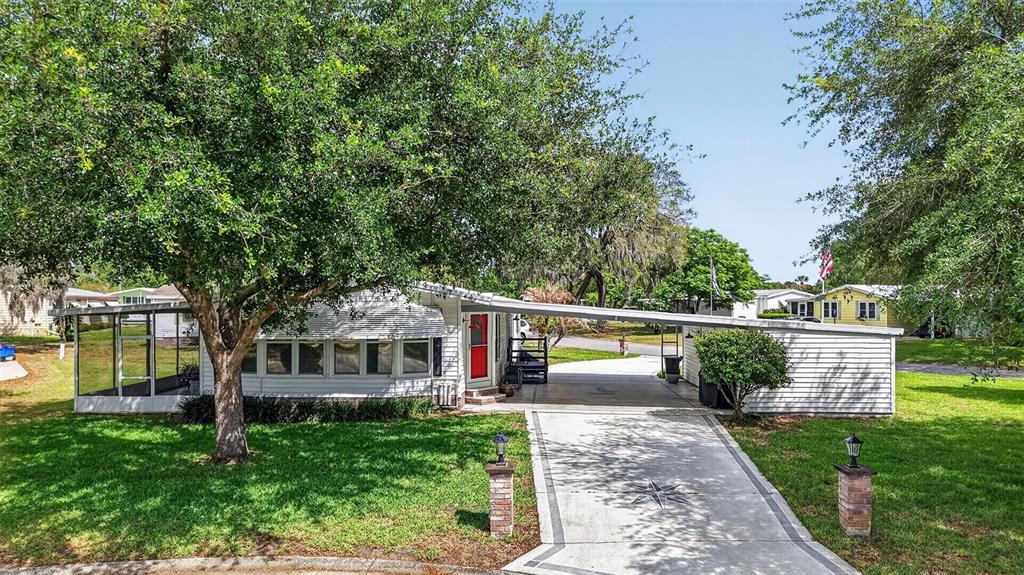 705 Devon Drive Lady Lake, FL 32159 - Photo 2 of 31 a view of house with outdoor space