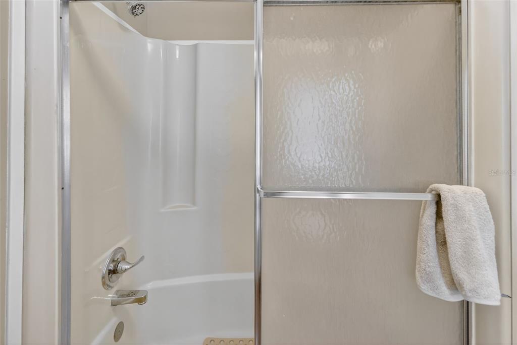 705 Devon Drive Lady Lake, FL 32159 - Photo 21 of 31 a bathroom with a shower