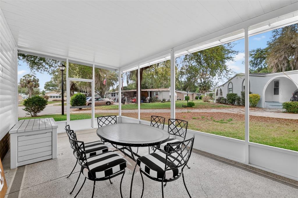 705 Devon Drive Lady Lake, FL 32159 - Photo 22 of 31 a outdoor space with chairs