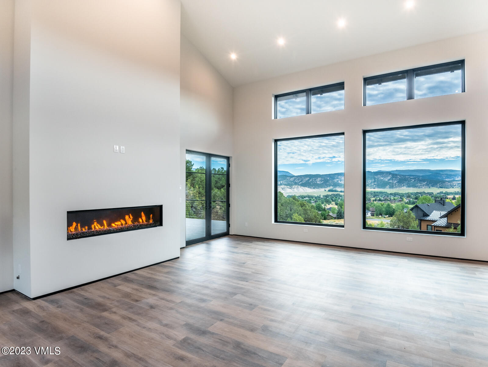 125 Silver Spur Eagle, CO 81631 - Photo 11 of 48 a view of a room with window a ceiling fan and wooden floor