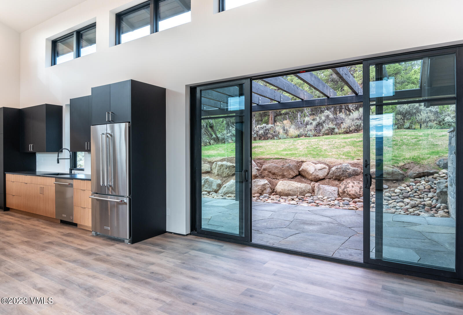 125 Silver Spur Eagle, CO 81631 - Photo 13 of 48 a view of a kitchen with furniture refrigerator and wooden floor