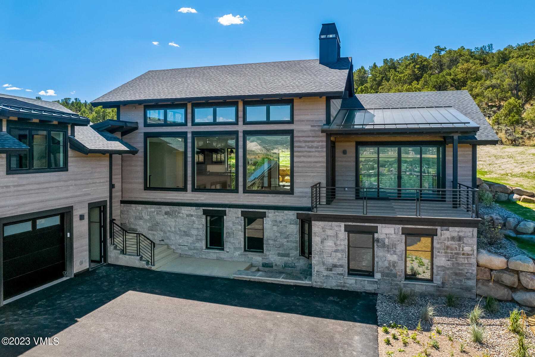 125 Silver Spur Eagle, CO 81631 - Photo 16 of 48 a front view of a house with a garden