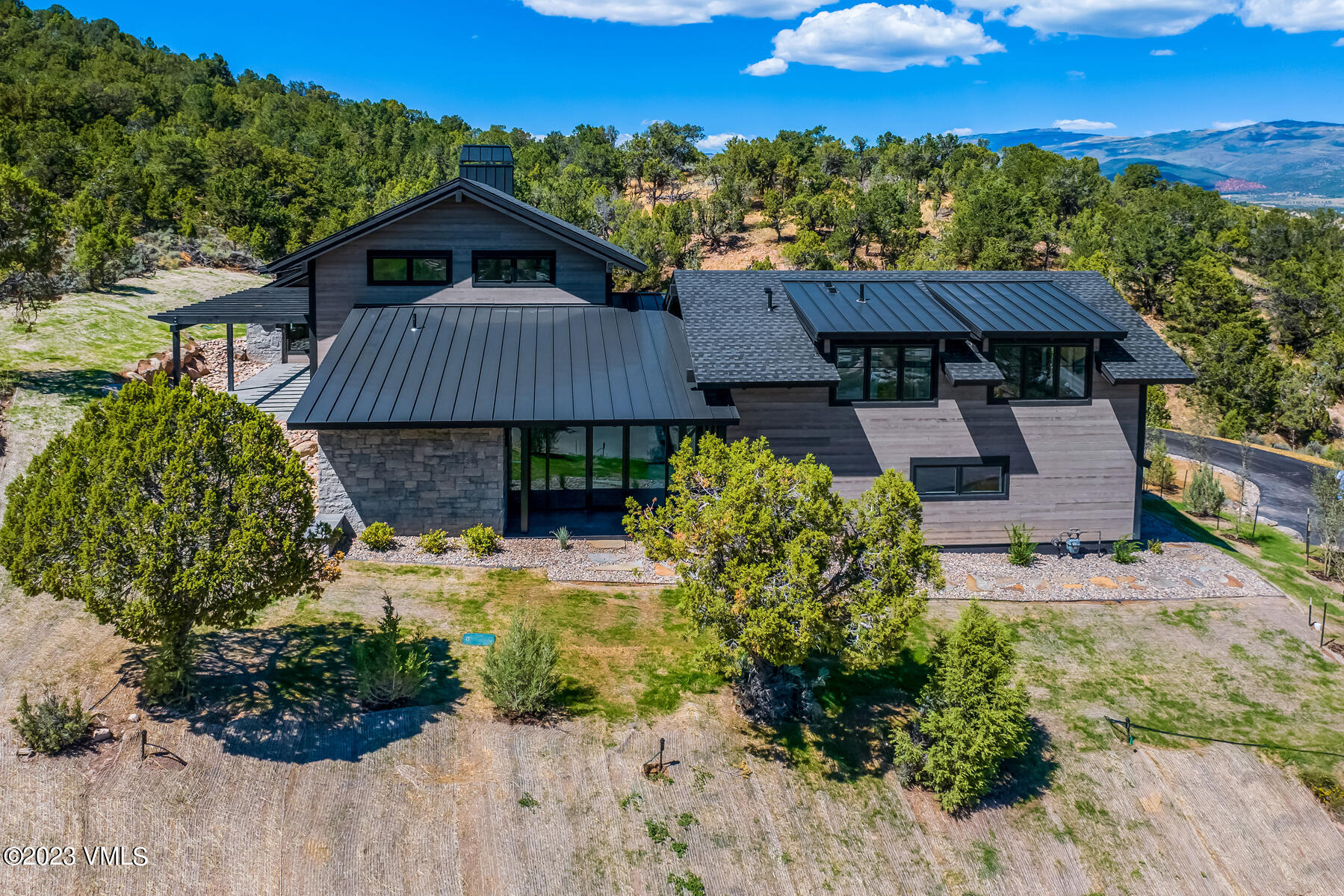 125 Silver Spur Eagle, CO 81631 - Photo 19 of 48 a view of a small house with a yard