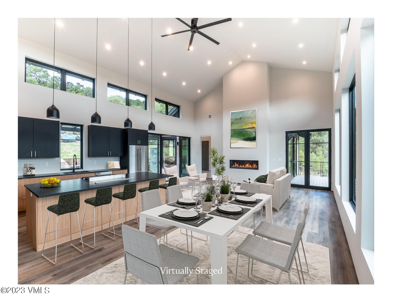 125 Silver Spur Eagle, CO 81631 - Photo 2 of 48 a living room with lots of furniture and kitchen view