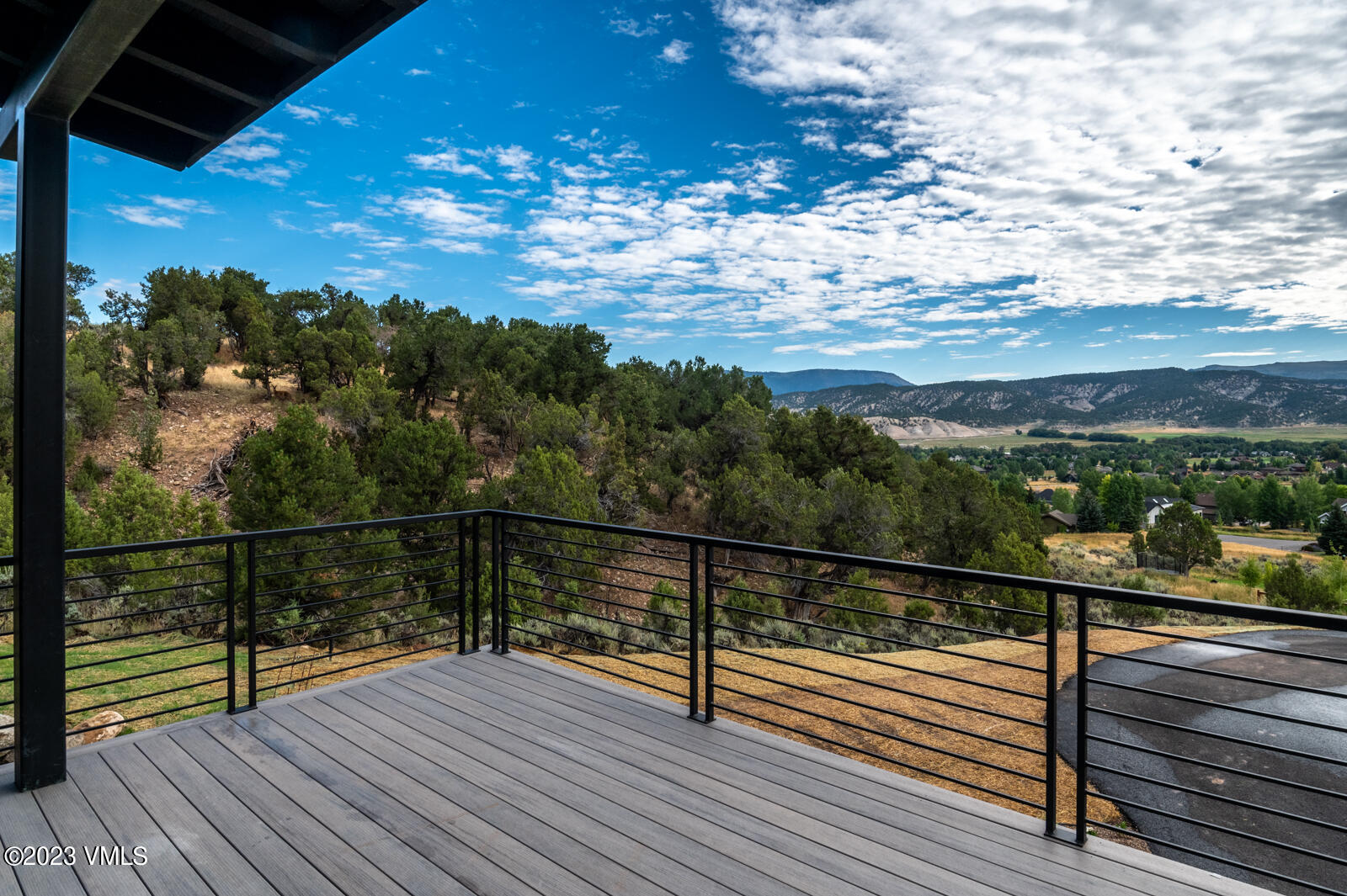 125 Silver Spur Eagle, CO 81631 - Photo 27 of 48 a view of a balcony with wooden floor next to a yard