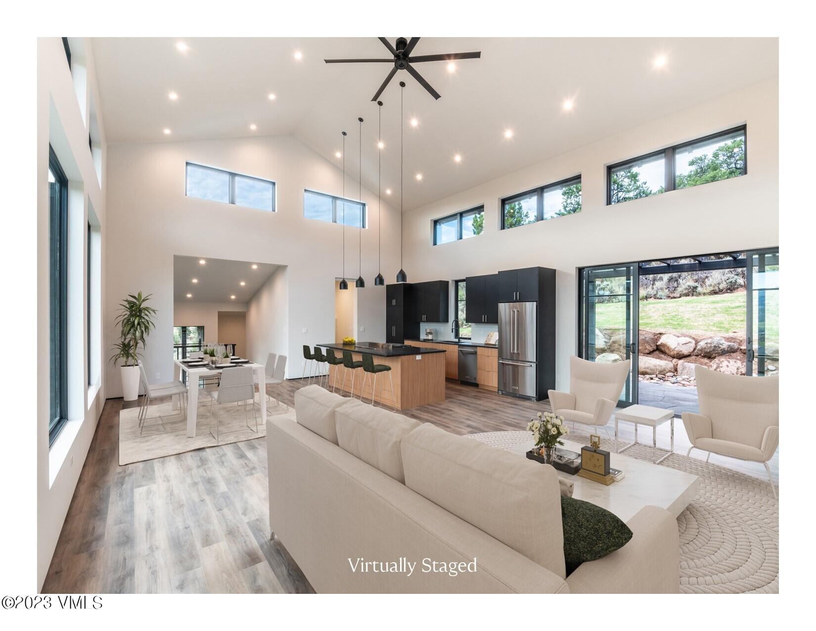 125 Silver Spur Eagle, CO 81631 - Photo 3 of 48 a living room with furniture and a large window