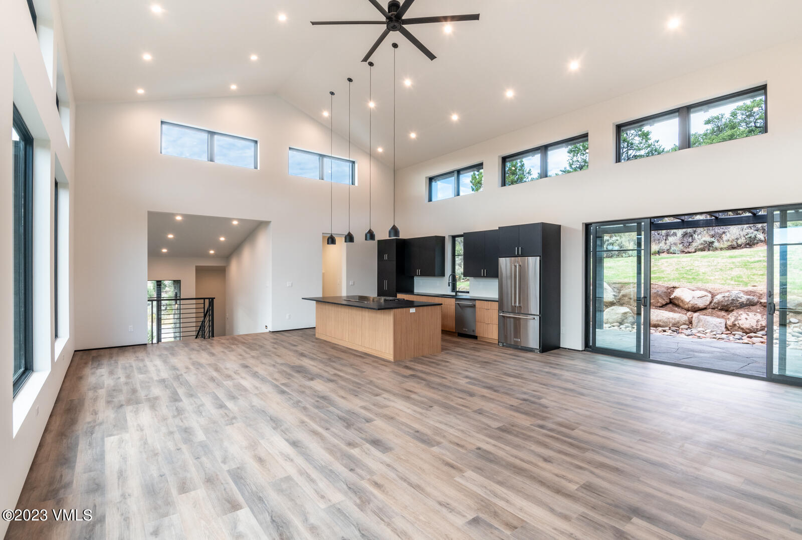 125 Silver Spur Eagle, CO 81631 - Photo 10 of 48 a view of an empty room with kitchen and window