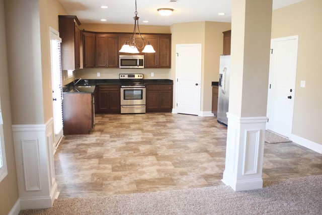 8 Fast Lane Fort Mitchell, undefined 36856 - Photo 12 of 44 a kitchen with stainless steel appliances granite countertop a stove a sink and a refrigerator
