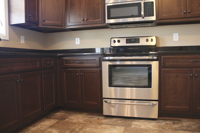 8 Fast Lane Fort Mitchell, undefined 36856 - Photo 15 of 44 a kitchen with stainless steel appliances granite countertop a stove microwave and cabinets