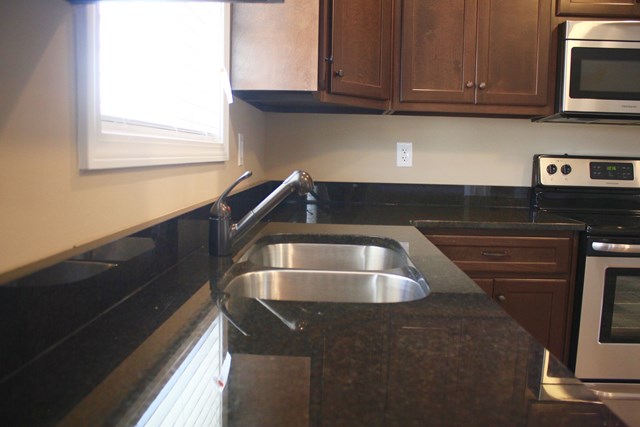 8 Fast Lane Fort Mitchell, undefined 36856 - Photo 18 of 44 a kitchen with a sink and cabinets