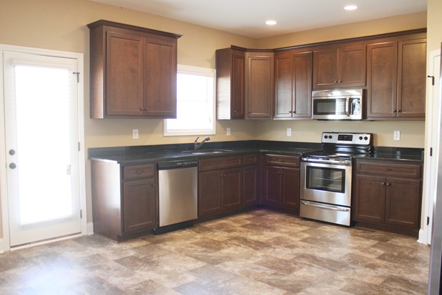8 Fast Lane Fort Mitchell, undefined 36856 - Photo 19 of 44 a kitchen with stainless steel appliances granite countertop a stove a sink and a refrigerator