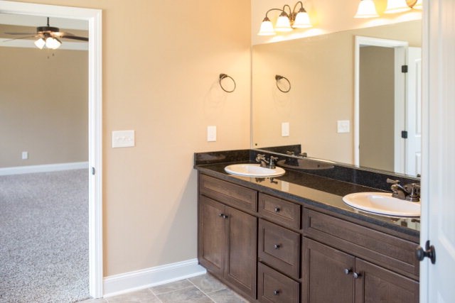 8 Fast Lane Fort Mitchell, undefined 36856 - Photo 34 of 44 a bathroom with a granite countertop sink and a mirror