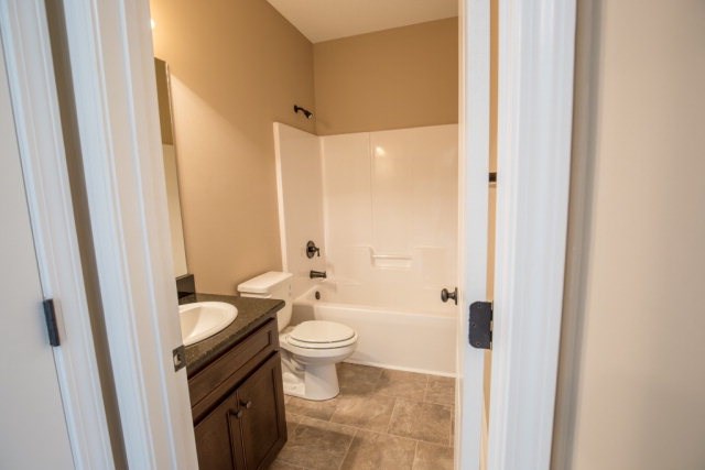 8 Fast Lane Fort Mitchell, undefined 36856 - Photo 36 of 44 a bathroom with a granite countertop sink toilet and shower