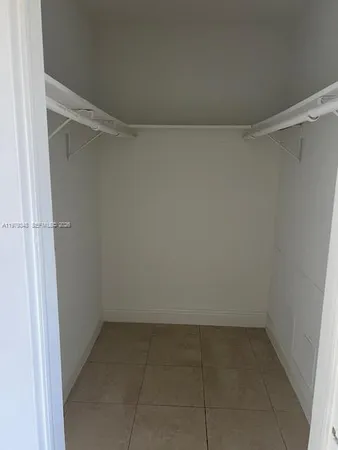 a view of an empty walk in closet