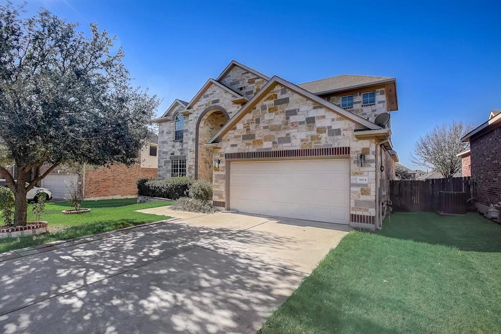3604 Rams Horn Way Round Rock, TX 78665 - Photo 25 of 26 This appealing stone and brick facade home offers a generous driveway, inviting you to a two-car garage and manicured front lawn.